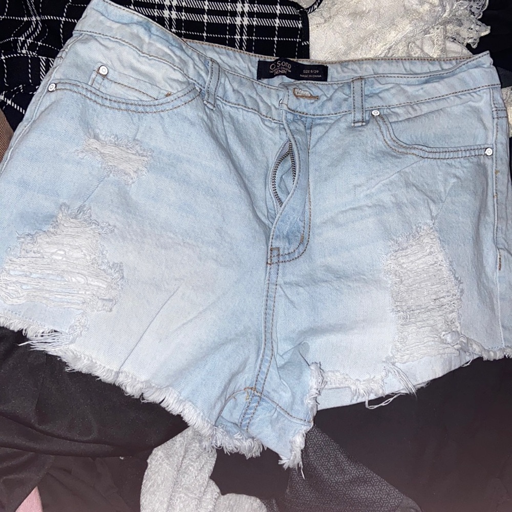 Small blue shorts with pockets included both front and back.
